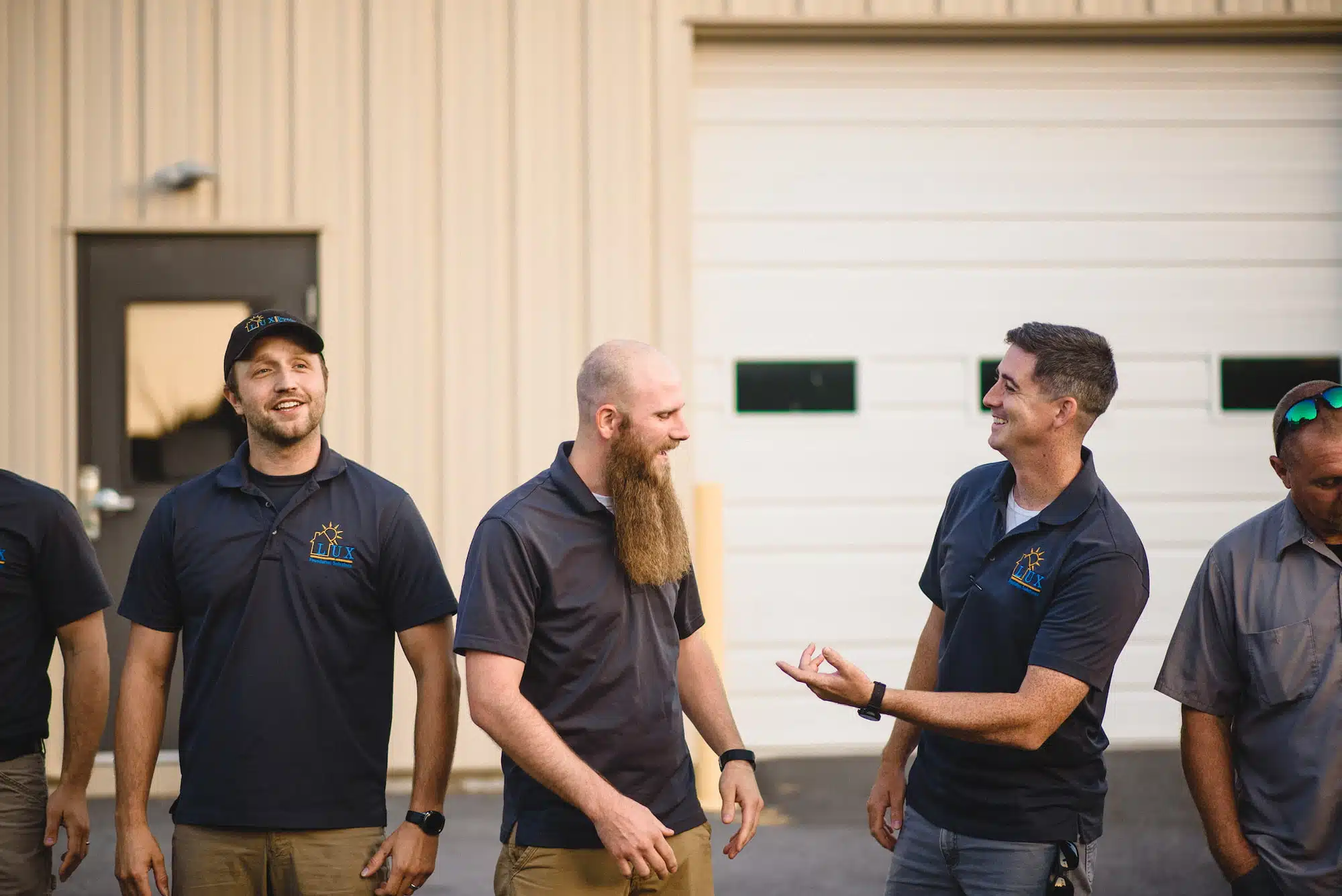 The Lux team of employees standing outside