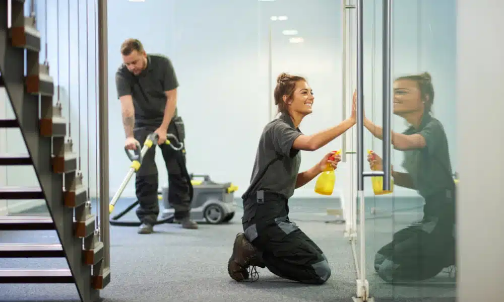 2 workers cleaning a commercial office