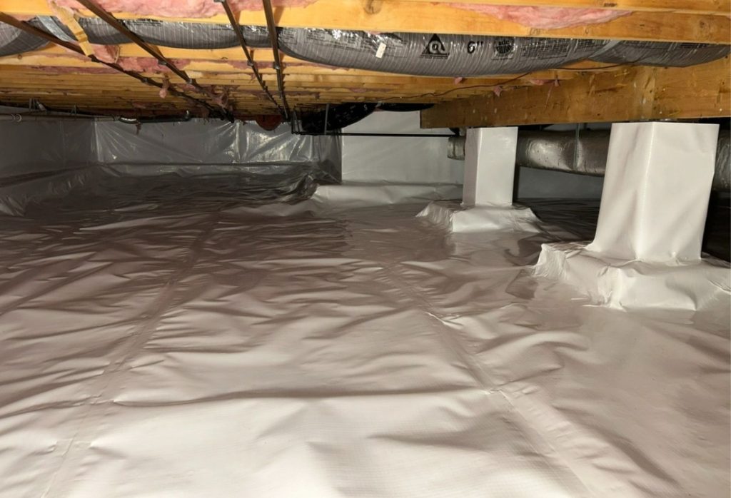 Encapsulated crawl space with vapor barrier and insulation that prevent mold and cut energy bills, showing the worth of crawl space encapsulation in Fairfax, VA.