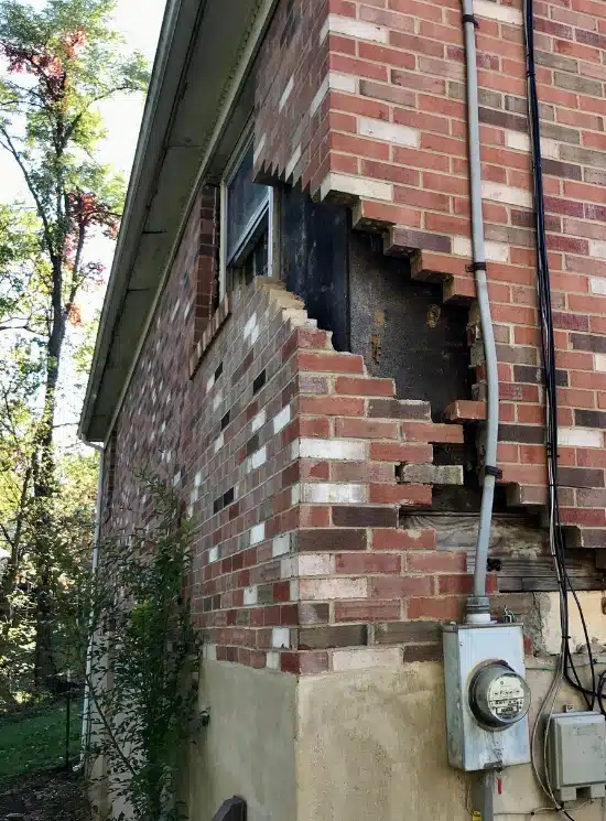 Foundation with damaged wide cracks, a foundation settlement sign that needs foundation settlement repair in Northern Virginia.