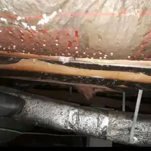 A crawl space with condensation that can cause wooden structures to deteriorate, resulting in rotted wood in Brambleton, VA.