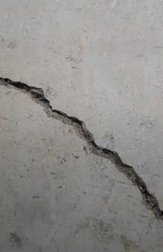 A deep crack in walls, showing the need for crack repair services in Northern Virginia to fix cracks in concrete walls.