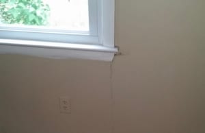 A horizontal crack located adjacent near the window an evident signs of foundation cracks in Berkeley, WV.