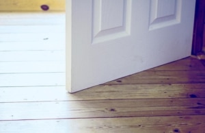 An image of a door that doesn't close properly, affecting its alignment, a sign of drywall cracks in Berryville, VA