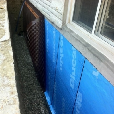 A house with installed exterior waterproofing in Berryville, VA, an effective solution to prevent damp basement issues.