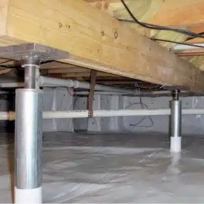 A crawl space with a floor joist stabilizer installation in Martinsburg, WV, a solution to address sticking doors and windows.