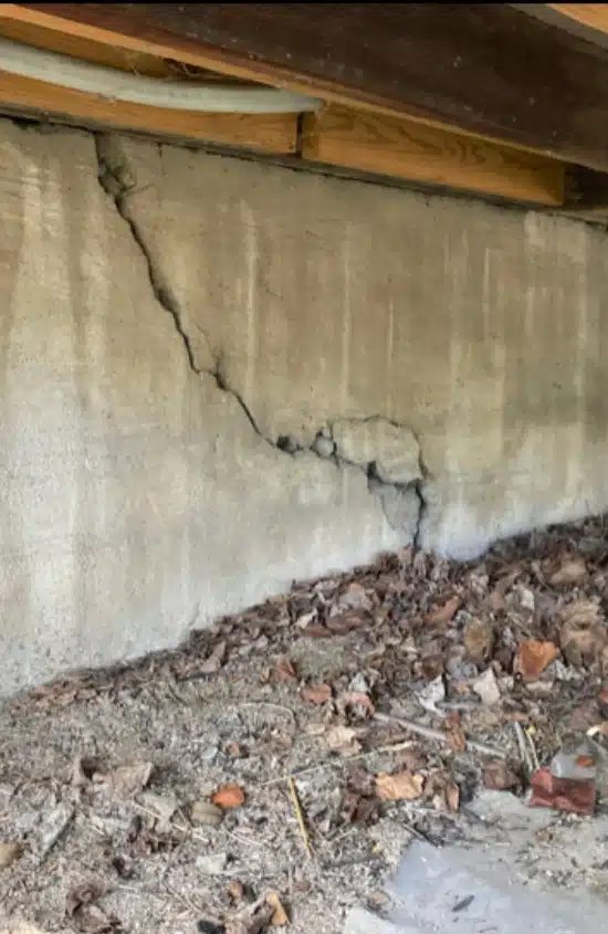 A crack in crawl space foundation wall, a sign of a crawl space problem that needs foundation crack repair in Northern VA.