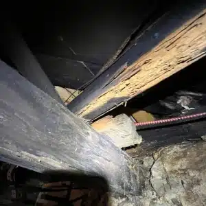 A damaged wood due to improper support, an inadequate or deteriorating support beams as the cause of sagging floors in Berkeley, WV