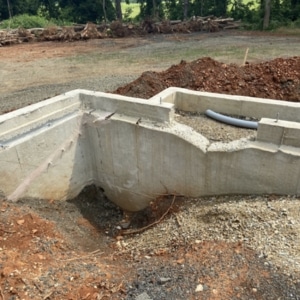 Improper and poor construction practices in constructing a house foundation cause chipping concrete in Berryville, VA.