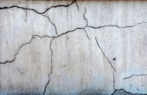 Concrete surface with noticeable shallow and deep pitting indicates deterioration and chipping concrete in Flint Hill, VA.