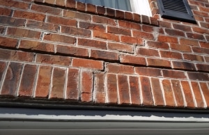 A foundation mortar wall displaying a stair-step crack, which is a sign of mortar cracks in Stephens City, VA