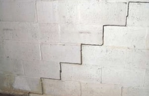A stair-step cracks in the foundation wall, a sign of potential bowing walls in White Post, VA
