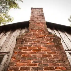 A weak chimney demonstrating how structural instability can cause cracks in the chimney bricks in Berkeley, WV