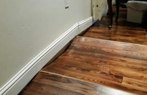 Photo showing uneven floors, a telltale sign of bowing walls in Reston, VA, affecting the home's structure.