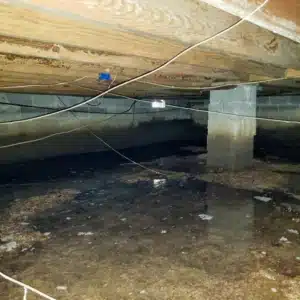 A crawl space with significant standing water, exemplifying moisture accumulation, can cause uneven floors in Fairfax, VA.