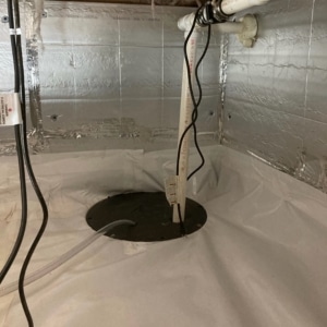 A crawl space sump pump to efficiently drain accumulated water as part of a crawl space drainage system in Springfield, VA.