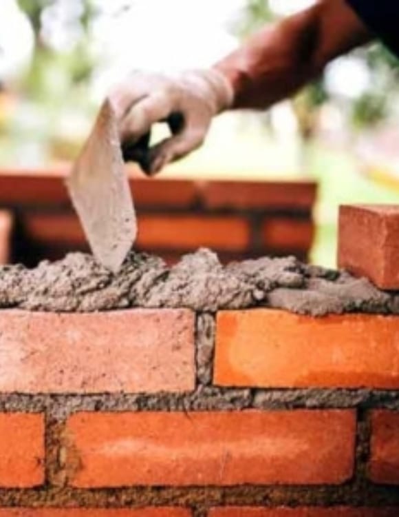 A man doing foundation wall replacement in Clear Brook, VA, for structural reinforcement.