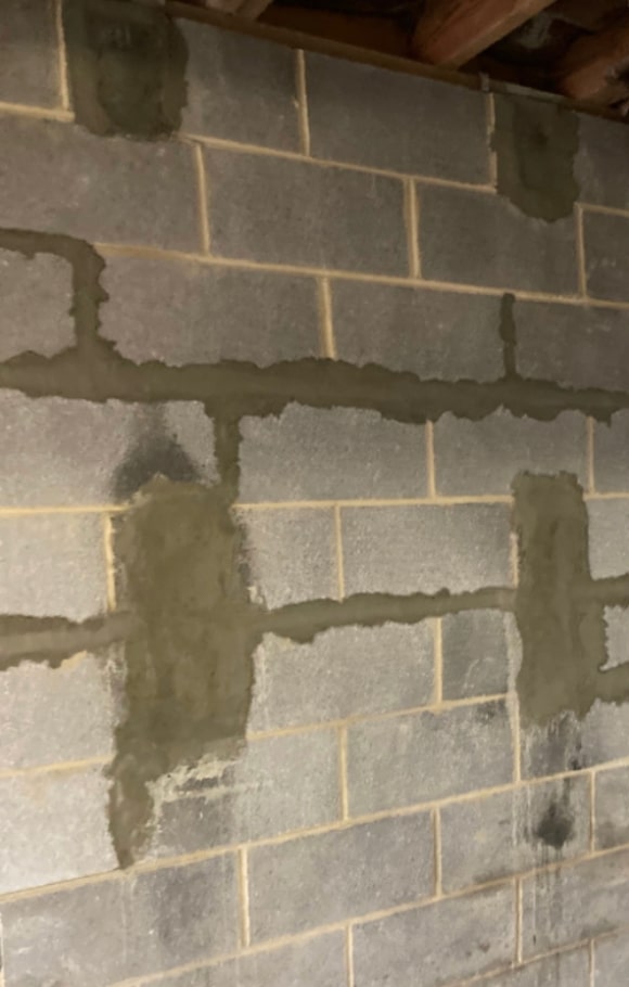 Image of LUX team performing wall rebar pins installation in Martinsburg, WV to reinforce walls.