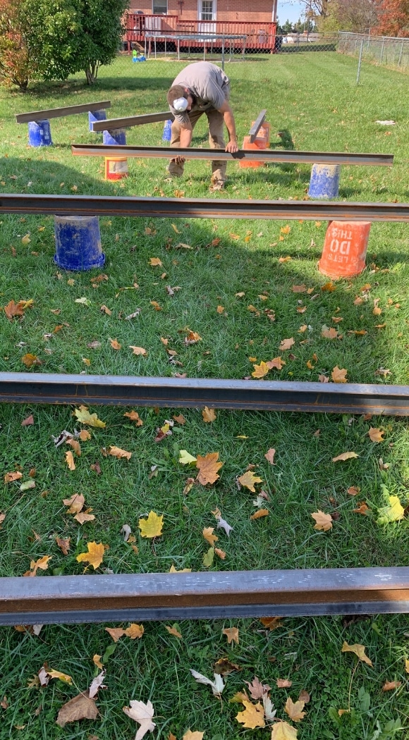 Image of LUX team performing carbon fiber installations in Fairfax, VA, to reinforce foundation walls.