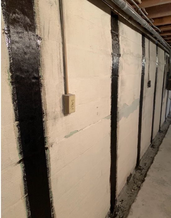 Image of professional wall anchors installation in Flint Hill, VA to rectify bowing foundation walls.