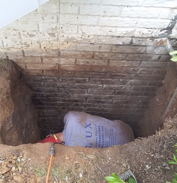 Image of LUX team performing concrete foundation crack repair in Southbridge, VA for structural reinforcement.