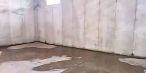 Illustration of a basement with water leaks in floor/walls, a sign of basement water damage in Harpers Ferry WV.