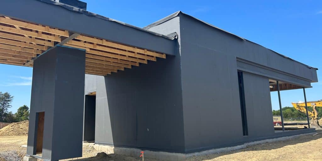 Fluid applied air barrier installation in White Post, VA, for protecting a building exterior.