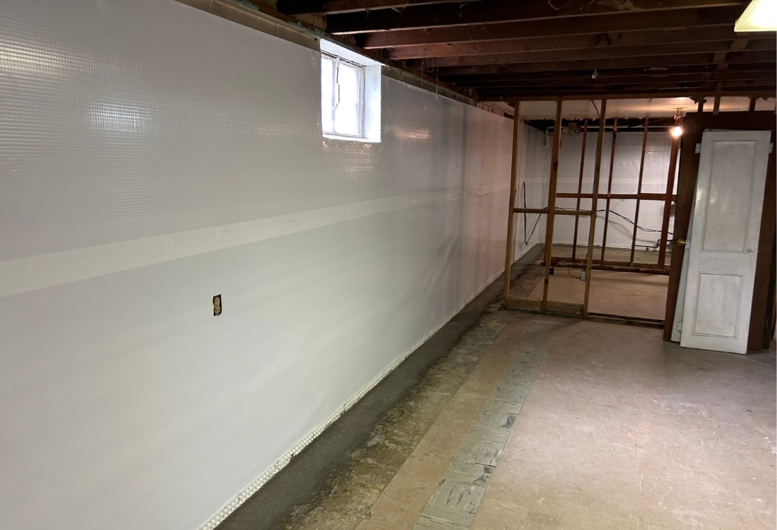 vapor barrier installed on a basement wall