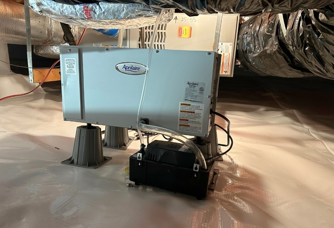 Dehumidifier installed in a crawl space