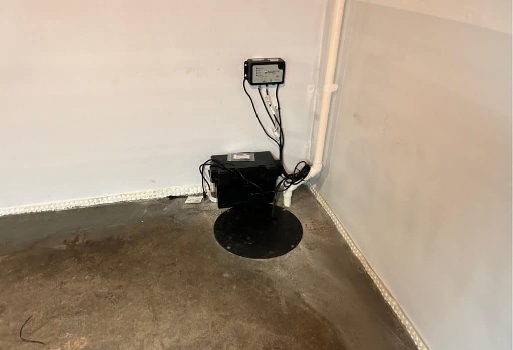 A submersible sump pump installed in a basement sump pit to remove excess water.