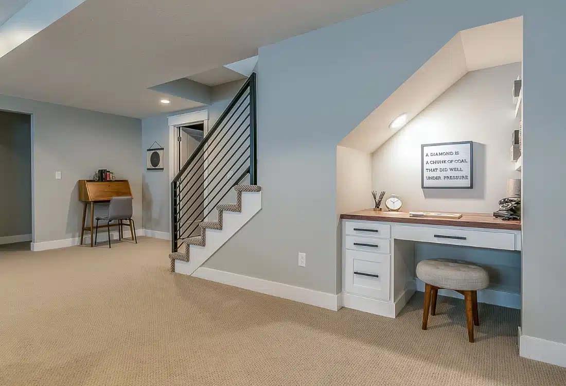 A clean, well-organized basement with neatly stored items and a dehumidifier running in the background.