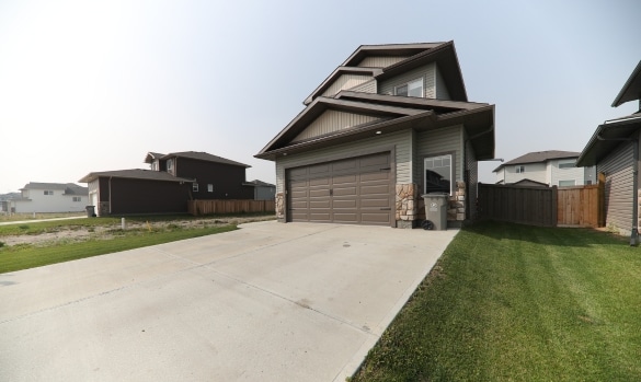An image of finished driveway concrete repair using polyurethane foam lifting restoring a smooth, safe surface.