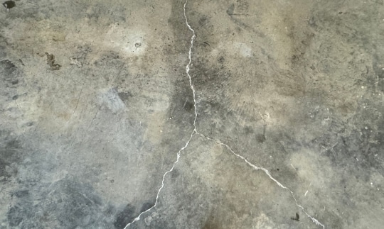 After image of finished garage floor concrete polyurethane foam lifting repair, demonstrating the restored surface.