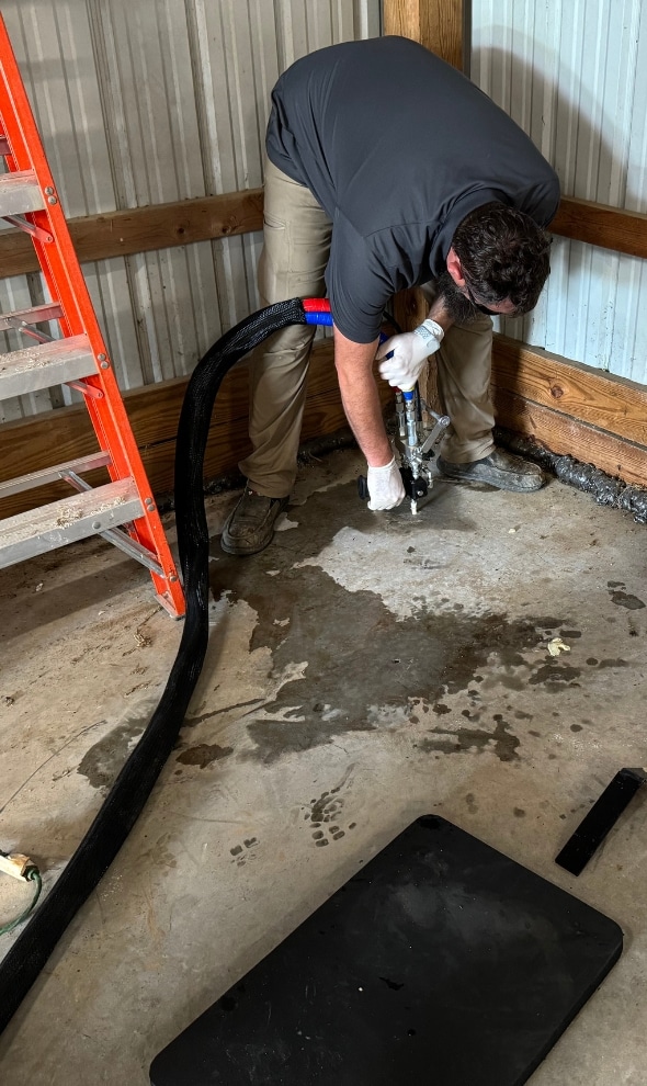 A LUX technician repairing a sunken concrete garage floor using the Precision Lift system.