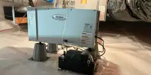 A high-quality image of a dehumidifier installed in a clean, dry crawl space.