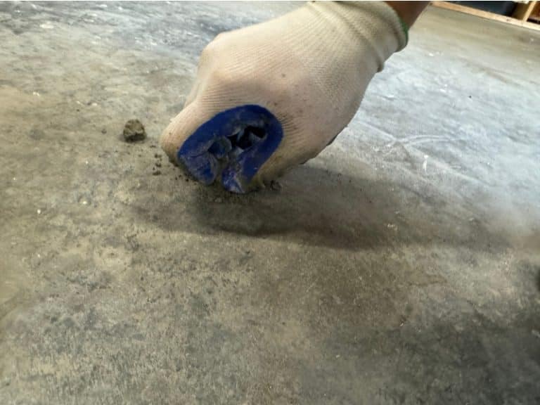 Cleaning the area after the crack sealing process and foam concrete lifting in Strasburg, VA.