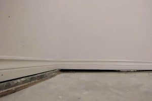 A visible gap between the basement slab and foundation wall indicates an uneven basement slab in Reston, VA.