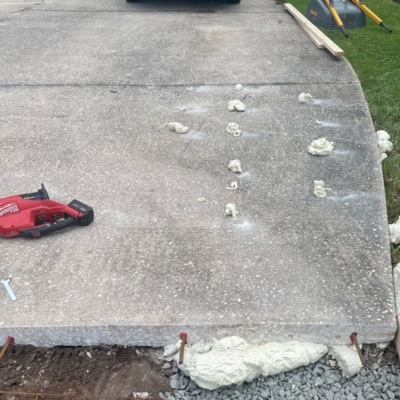 A driveway with injected polyurethane foam for the driveway crack repair to stabilize cracked driveways in Winchester, VA.