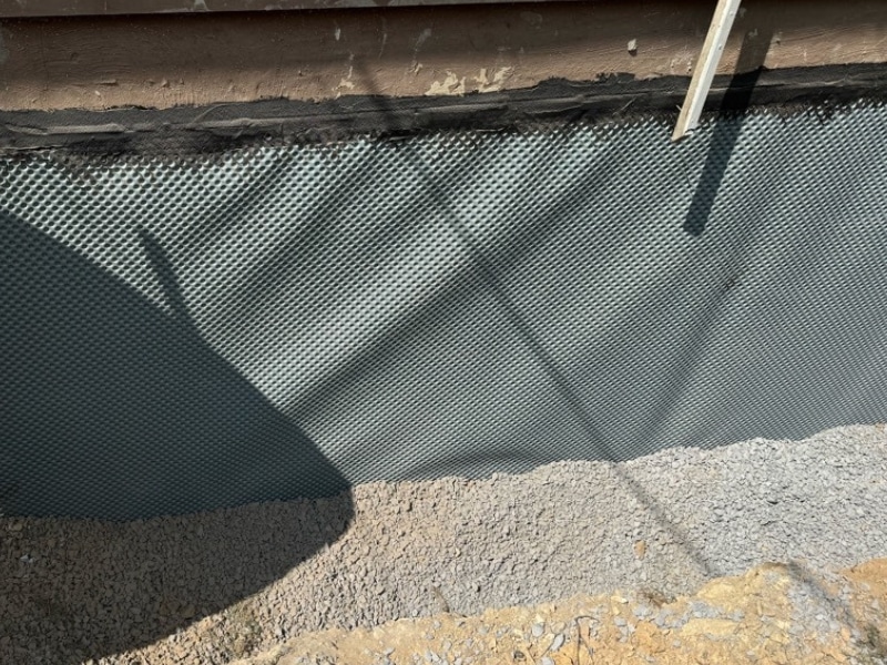 Waterproofing membrane applied to the repaired crumbling foundation to prevent water intrusion in Berryville, VA.