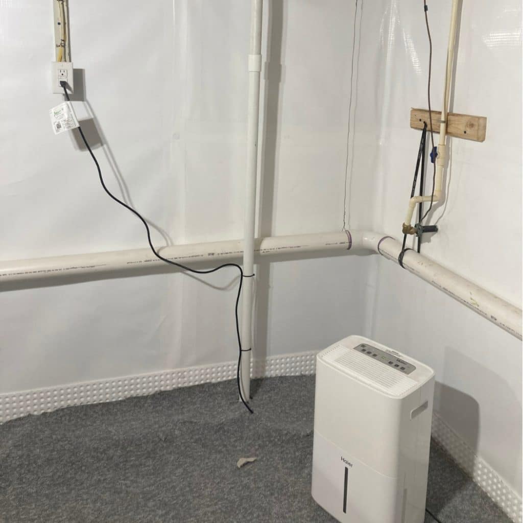 A basement dehumidifier installed, effectively reducing humidity and controlling condensation in Alexandria, VA.