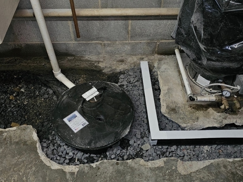 Basement sump pump installation in Tom’s Brook, VA, to manage water leaks and redirect moisture away from the foundation.