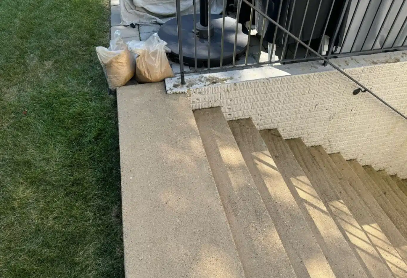 Cracked and bowed baGaps and voids under the stairway slab due to erosion before applying concrete void filling foam in Ashburn, VA.asement walls caused by soil pressure before foundation wall anchors installation in Stephens City, VA.