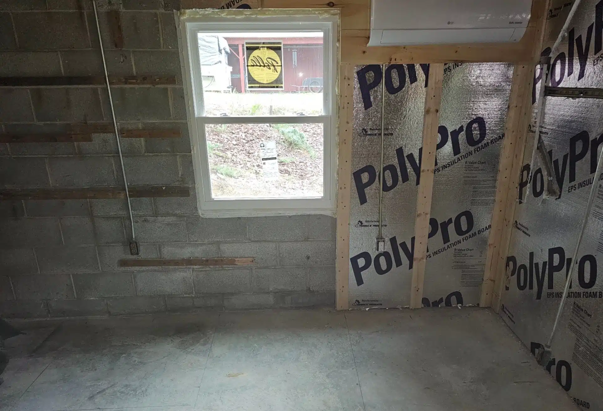 Basement foundation showing settling issues due to water damage, before foundation piering for stabilization in Strasburg, VA.