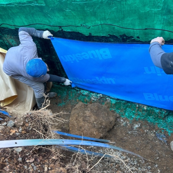 Installed exterior basement waterproofing membrane to protect it from water damage caused by poor construction in Clear Brook, VA.