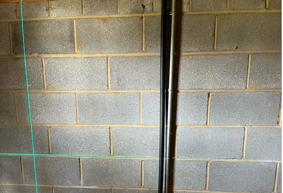 Visible stair-step cracks and bowing foundation walls in Martinsburg, WV, before carbon fiber repair and stabilization.