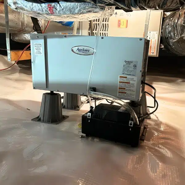 Installed crawl space dehumidifier to control humidity and prevent condensation from open crawl space vents in Southbridge, VA.