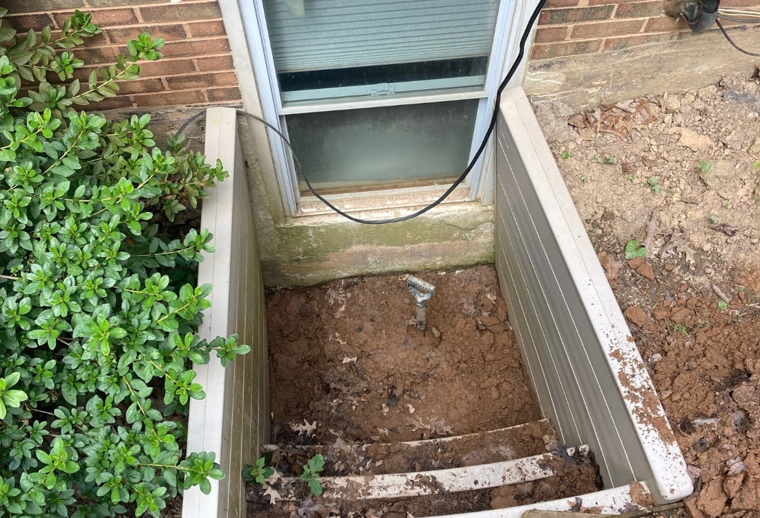 Excavated the old egress window well to prepare for a raised and sealed window well drainage solution in Fairfax, VA.