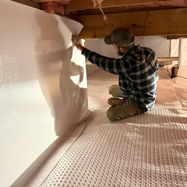 LUX team encapsulating crawl space to prevent moisture caused by water pooling from improper landscape grading in Martinsburg, WV.