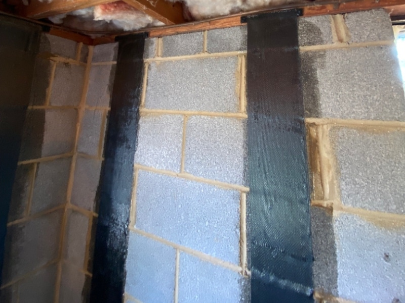 Installed top-mounted steel brackets on stair-step foundation cracks in Stephens City, VA, for added support.