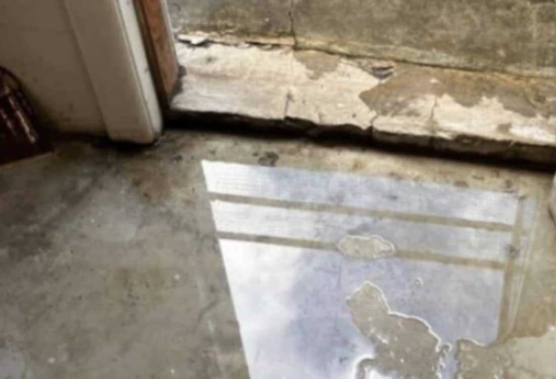 Leaky basement floor before waterproofing in Winchester, VA.